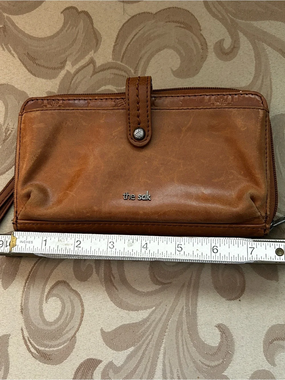 The Sak Smartphone Wristlet Wallet Iris Tobacco Brown Flower Embossed